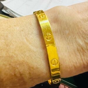 Aldo Cipullo with Charles Revson 1970 original version of the love bracelet